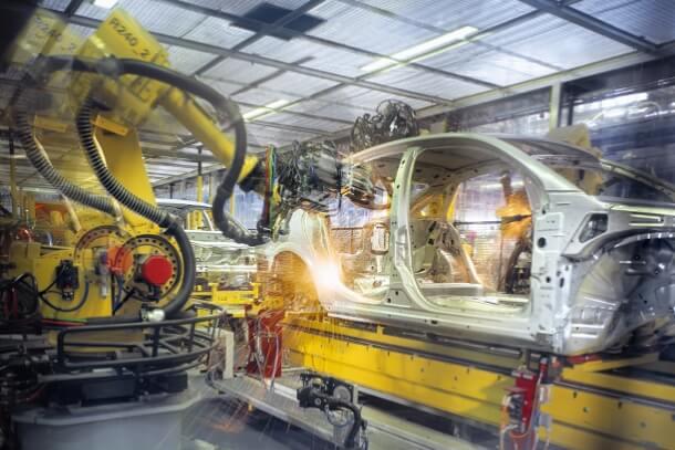 Automated manufacturing assembly line demonstrating reduced environmental impact through efficient lubrication technology